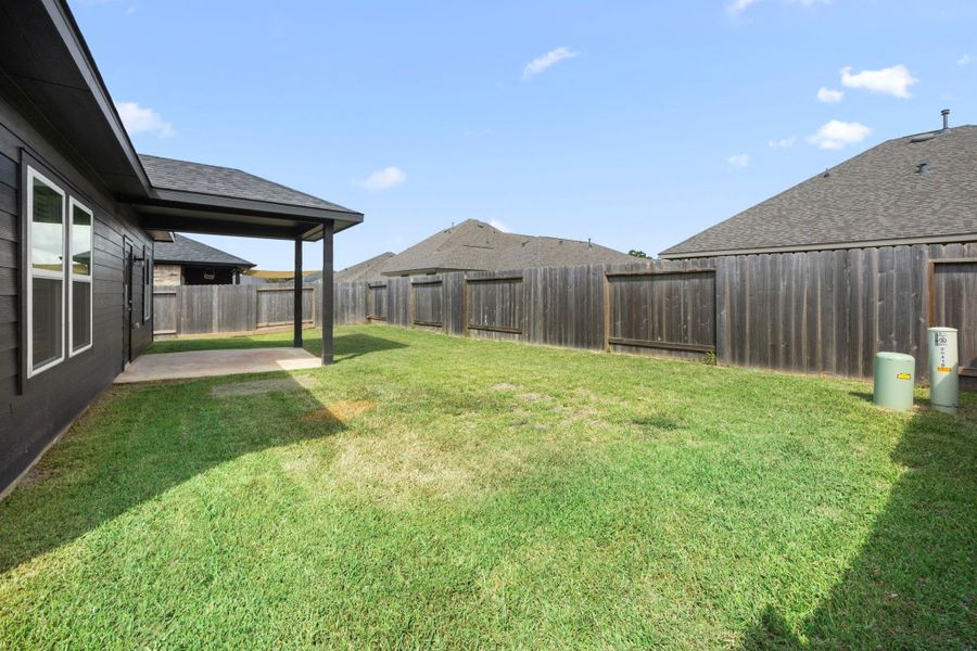 Exterior details and patio area of a home in Glen Oaks, Magnolia (Image 23). Exterior details and patio area of a home in Glen Oaks, Magnolia (Image 23).