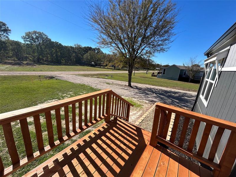 Wooden deck with a lawn