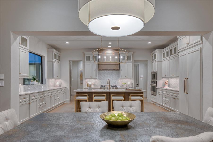Stunning kitchen overlooks the dining and family room. Stunning kitchen overlooks the dining and family room.