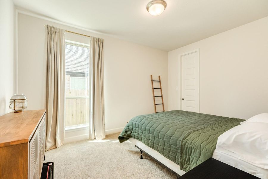 Spacious guest suite featuring pristine, like-new carpeting and a large closet for ample storage. Spacious guest suite featuring pristine, like-new carpeting and a large closet for ample storage.
