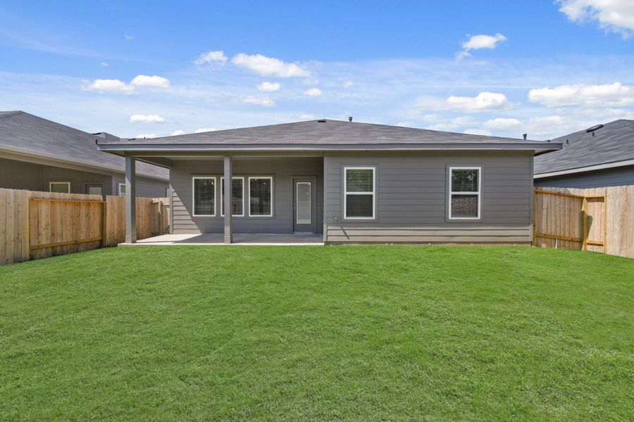 Exterior details and patio area of a home in Grand Pines, Magnolia (Image 3). Exterior details and patio area of a home in Grand Pines, Magnolia (Image 3).