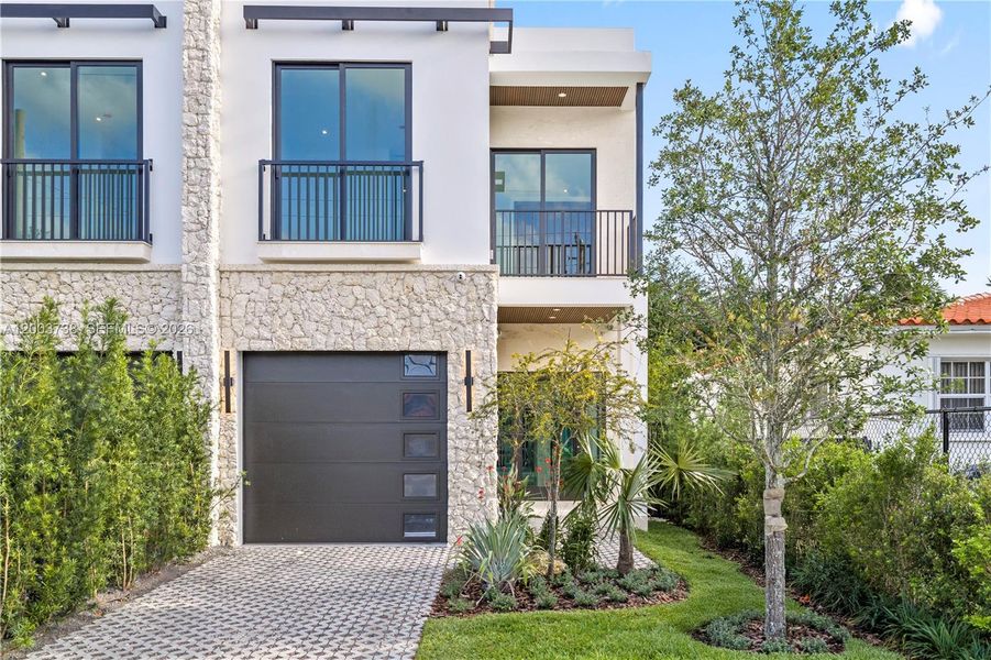Front exterior of a new home in , Miami, FL, highlighting curb appeal (Image 25).