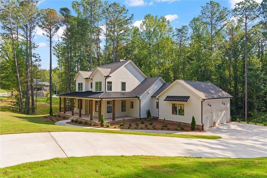 Front exterior of a new home in , Ball Ground, GA, highlighting curb appeal (Image 26).