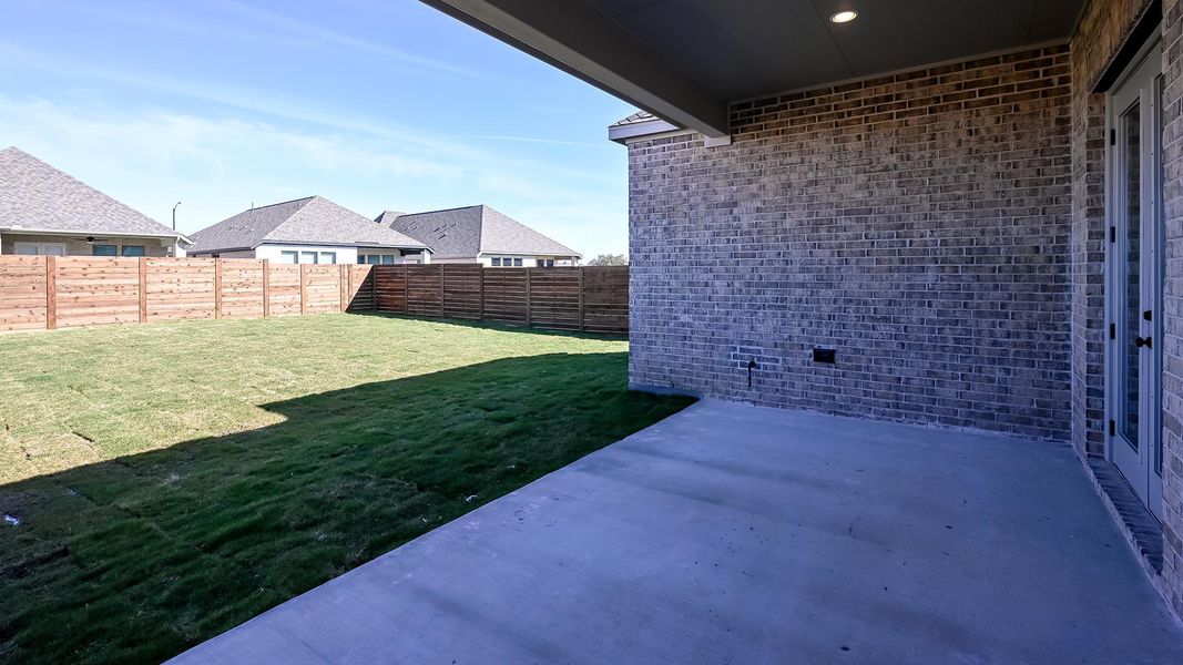 Exterior details and patio area of a home in Juniper Springs, Lockhart (Image 4).