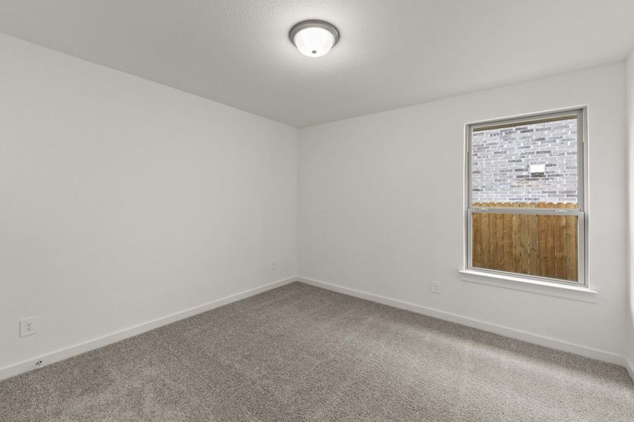 Representative unfurnished interior of a home built from the Olive III Harrington Trails Cornerstone I Series by Brohn Homes in Harrington Trails, New Caney (Image 25).