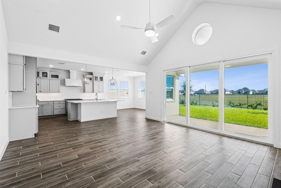 Sliding glass doors in the great room lead to the covered patio (*Photo not of actual home and used for illustration purposes only.)