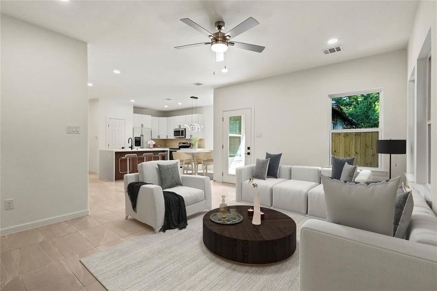 Living area featuring ceiling fan, recessed lighting, and light tile patterned floors