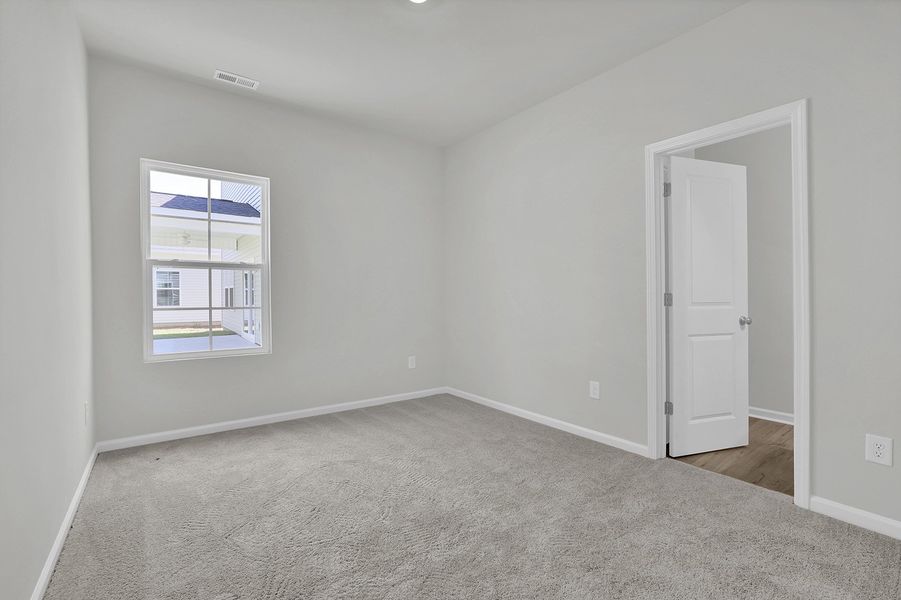 Spacious, unfurnished interior of a new home in River Tide Farms, Bolivia (Image 16).