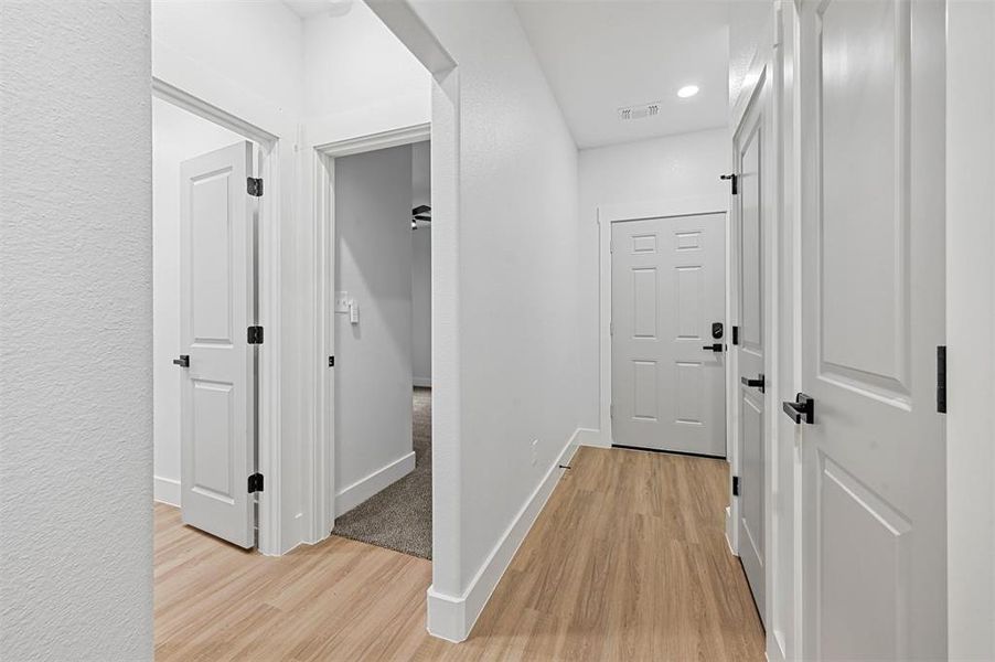 Corridor featuring light hardwood / wood-style flooring