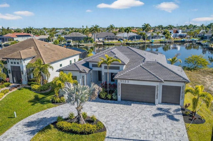 Front exterior of a new home in , Cape Coral, FL, highlighting curb appeal (Image 26). Front exterior of a new home in , Cape Coral, FL, highlighting curb appeal (Image 26).