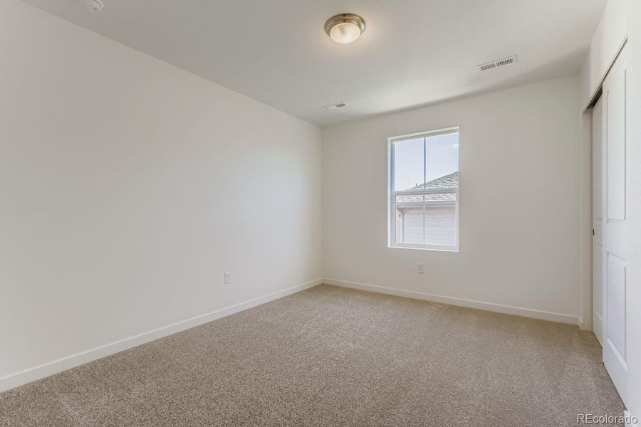 Spacious, unfurnished interior of a new home in Parterre: The Skyline Collection, Thornton (Image 9).