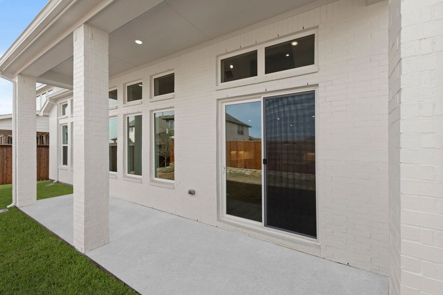 Exterior details and patio area of a home in Lily Creek at Sutton Fields, Aubrey (Image 2). Exterior details and patio area of a home in Lily Creek at Sutton Fields, Aubrey (Image 2).