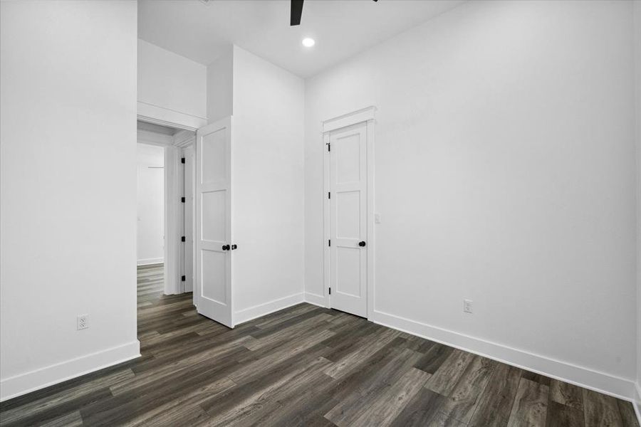 Unfurnished room featuring dark wood-style floors, recessed lighting, and ceiling fan