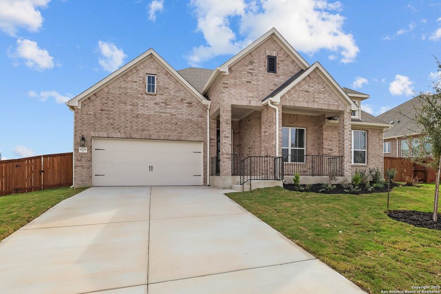 Front exterior of a new home in Homestead, Schertz, TX, highlighting curb appeal (Image 1).