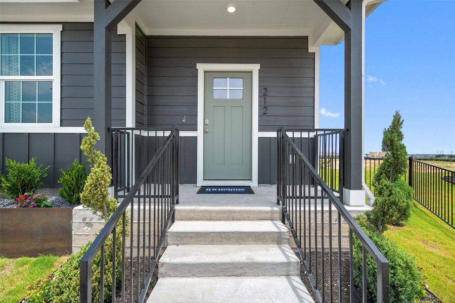Front exterior of a new home in Valverde, Bastrop, TX, highlighting curb appeal (Image 22). Front exterior of a new home in Valverde, Bastrop, TX, highlighting curb appeal (Image 22).