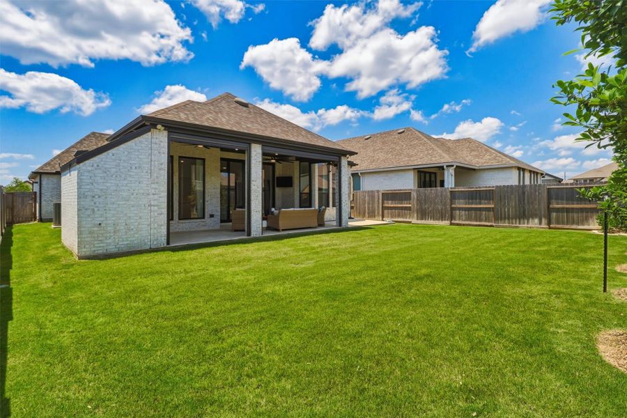 Exterior details and patio area of a home in , Brookshire (Image 27).