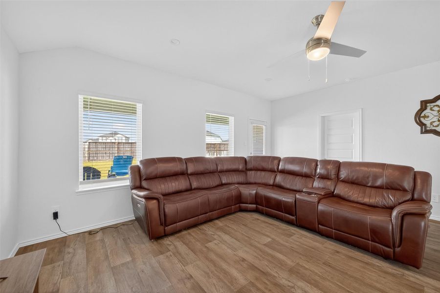 Designer finishes, elegant flooring, and sophisticated architectural touches elevate the home’s aesthetic.