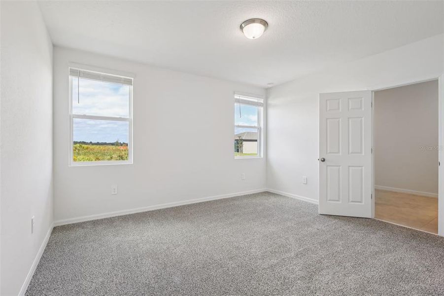 Spacious, unfurnished interior of a new home in Lake Deer Estates - Signature Series, Poinciana (Image 28).