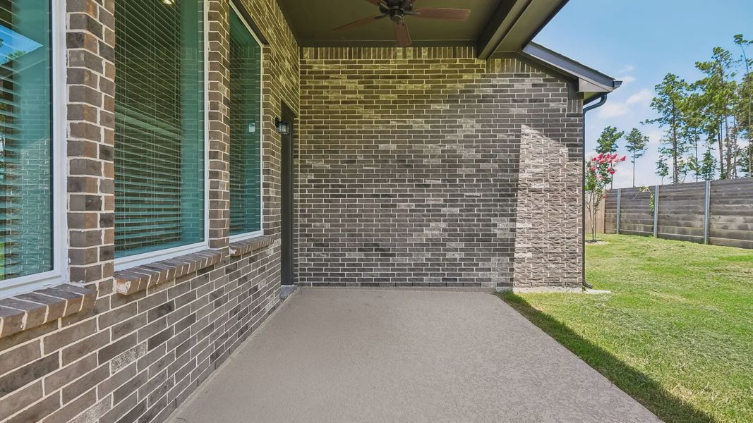 Exterior details and patio area of a home in Artavia, Conroe (Image 24).