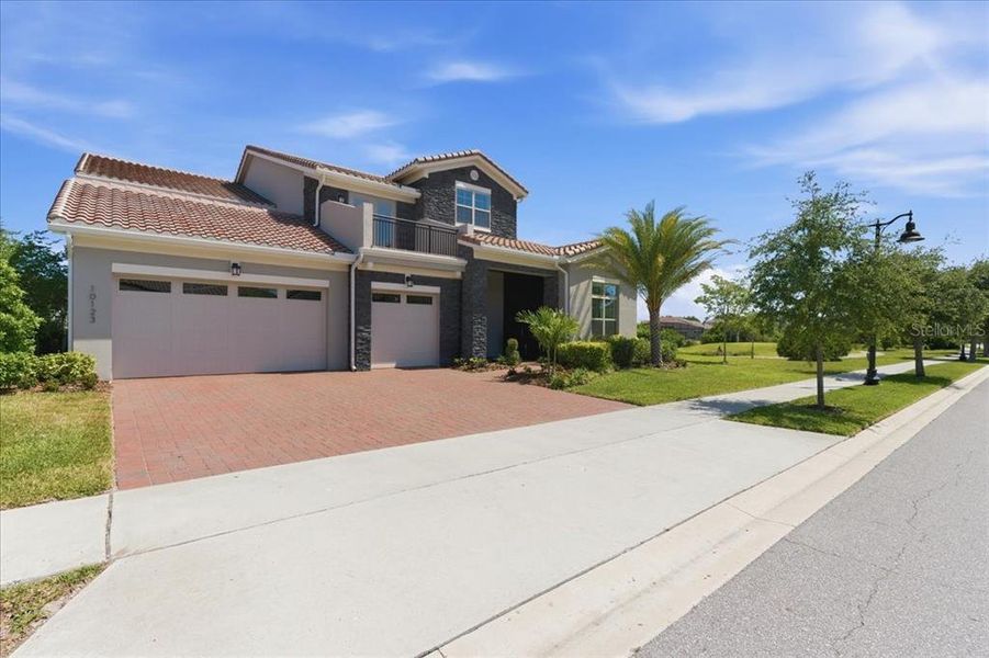 Front exterior of a new home in , Orlando, FL, highlighting curb appeal (Image 21).