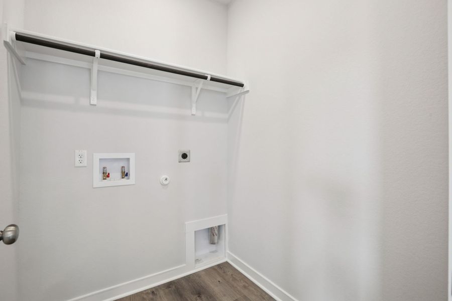 A white wall with a white door.