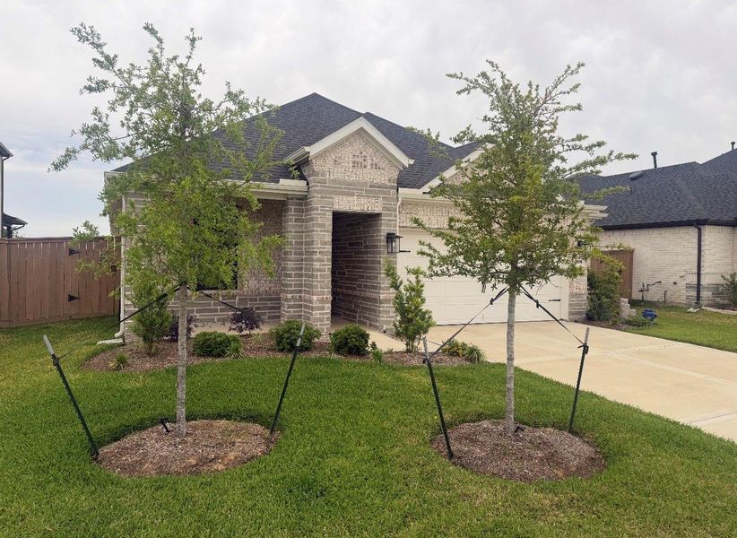 Front exterior of a new home in , Katy, TX, highlighting curb appeal (Image 1). Front exterior of a new home in , Katy, TX, highlighting curb appeal (Image 1).