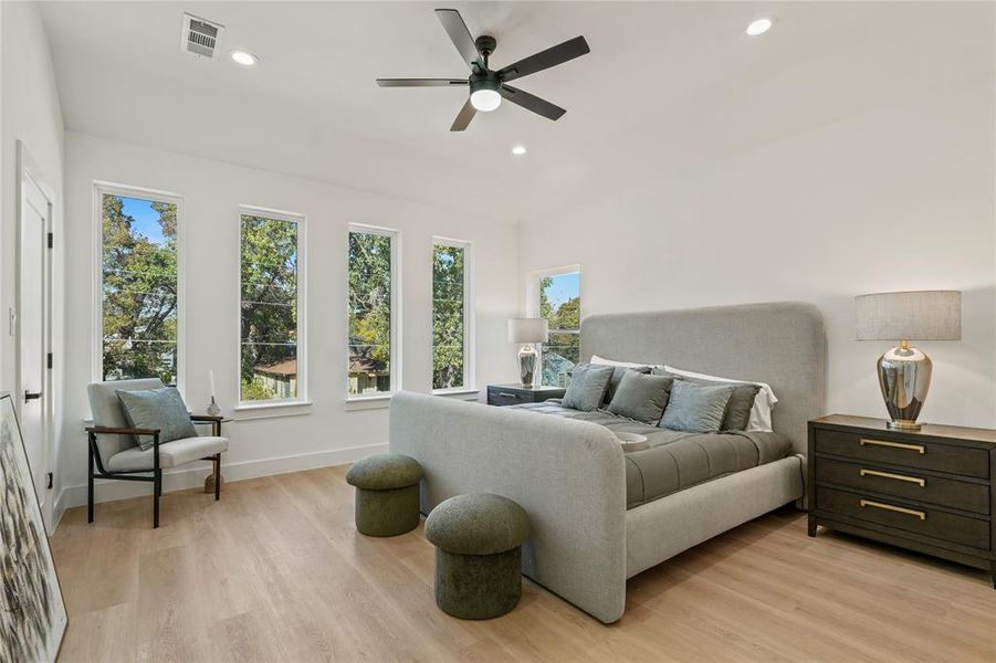 Bedroom with light wood-style flooring, recessed lighting, and ceiling fan