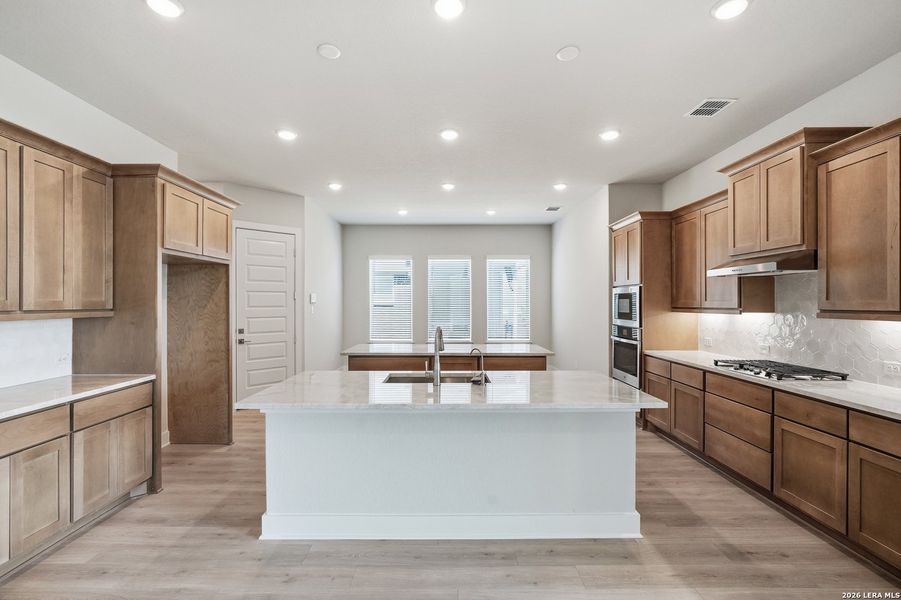 Furnished interior view inside a new home in Potranco Oaks, Castroville (Image 12).