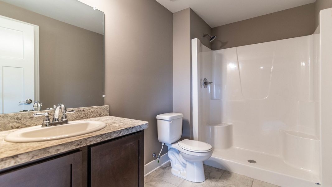 Representative furnished interior of a home built from the The Boulder Side Entry by Norfolk Homes in The Grande Estates, Jackson (Image 15).