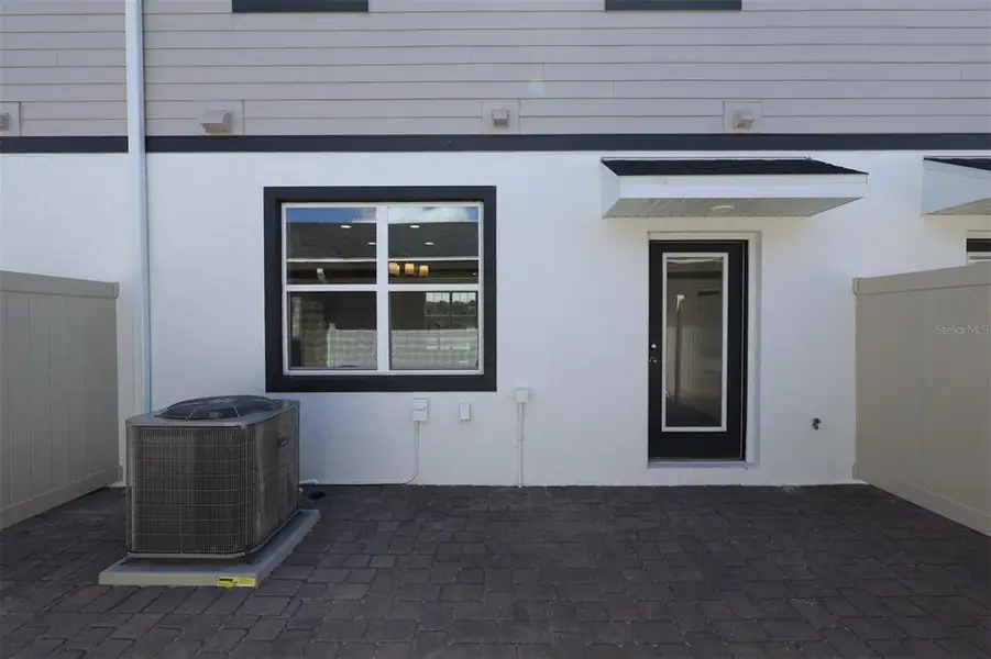 Exterior details and patio area of a home in Center Lake on the Park, St. Cloud (Image 3).