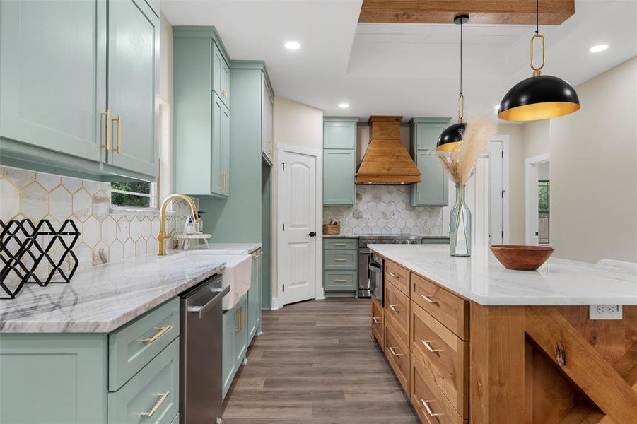 Kitchen with custom exhaust hood, dishwasher, dark wood finished floors, decorative backsplash, and recessed lighting