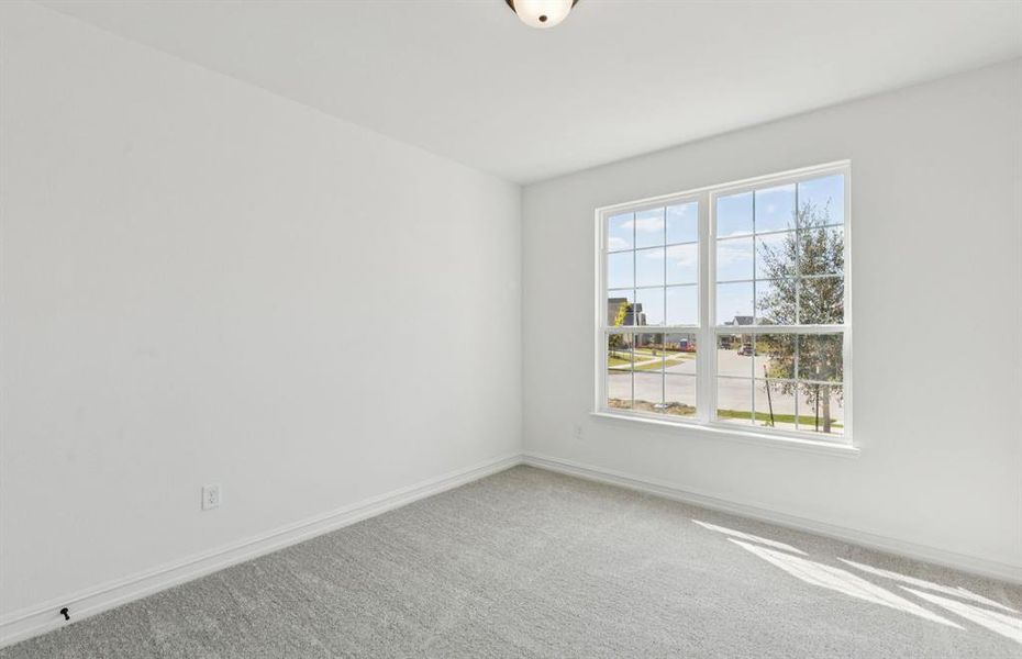 Spacious secondary bedroom with large windows Spacious secondary bedroom with large windows