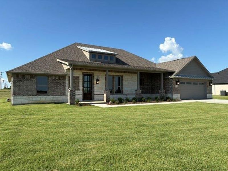 Front exterior of a new home in , Van Alstyne, TX, highlighting curb appeal (Image 25). Front exterior of a new home in , Van Alstyne, TX, highlighting curb appeal (Image 25).