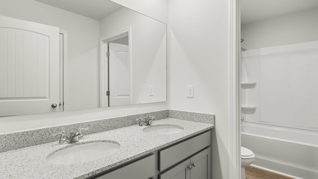 Representative furnished interior of a home built from the HALTON by D.R. Horton in Lost Creek, Dallas (Image 16).