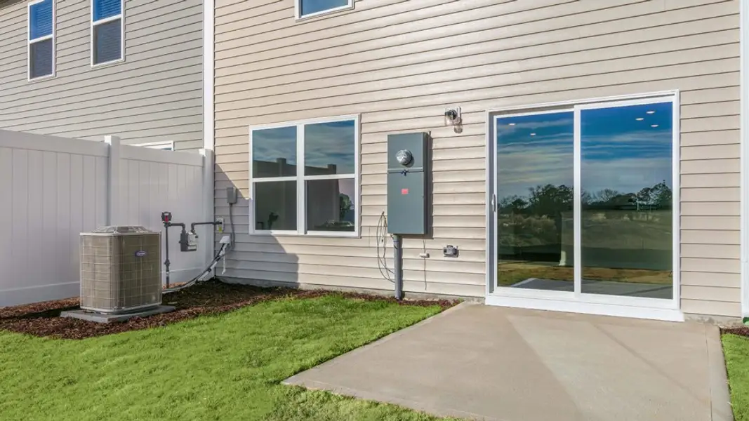 Exterior details and patio area of a home in The Townes at Honeycutt Oaks, Angier (Image 3).