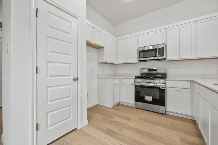Kitchen in the Birch home plan by Trophy Signature Homes – REPRESENTATIVE PHOTO