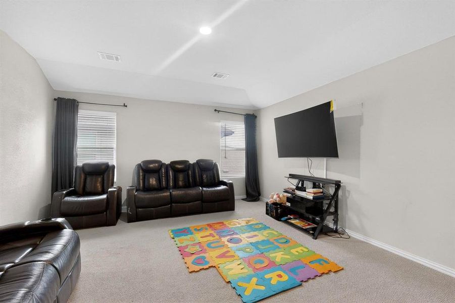 Carpeted living room with baseboards Carpeted living room with baseboards