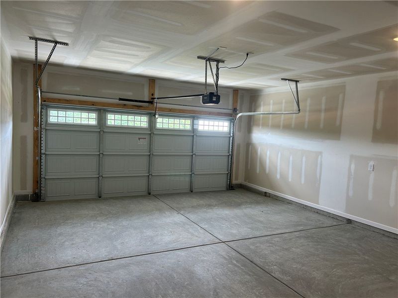 Ample space with concrete flooring and a modern ga