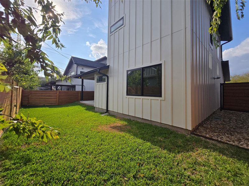 Plenty of space in the backyard for entertaining activities, or your pet to go outside as needed. Wide metal framed gate on the right side can be seen as well. Plenty of space in the backyard for entertaining activities, or your pet to go outside as needed. Wide metal framed gate on the right side can be seen as well.