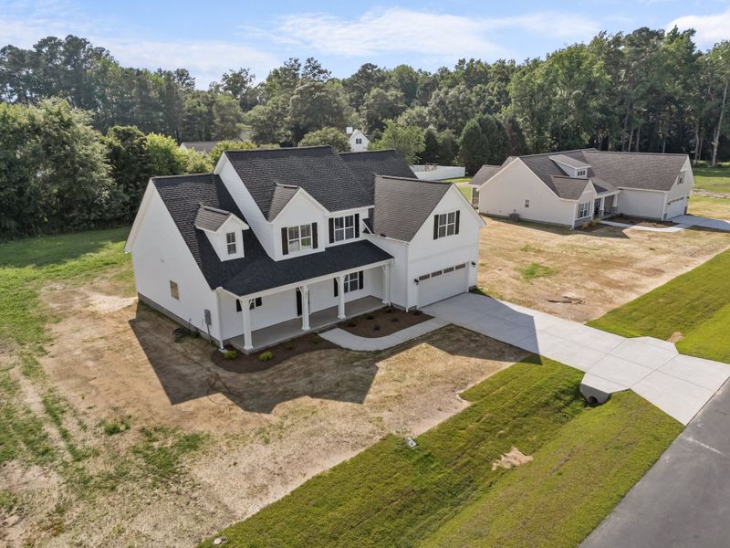 Representative exterior photo of a completed home built from the Albemarle by Bill Clark Homes in Kensington at Paramore, Winterville, NC (Image 38).
