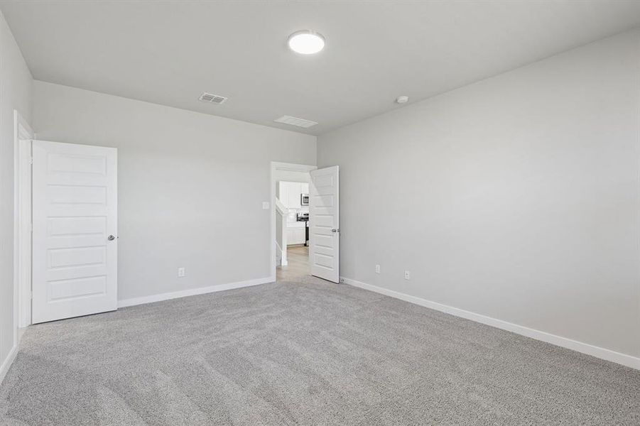 Primary Suite in the Holden home plan by Trophy Signature Homes – REPRESENTATIVE PHOTO