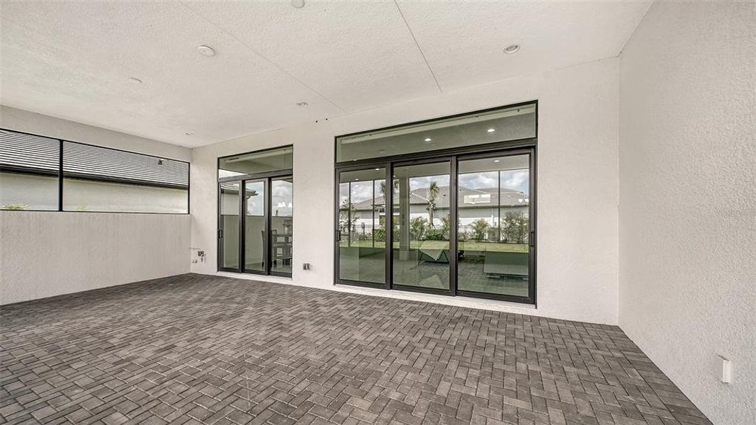 Exterior details and patio area of a home in Artistry Sarasota, Sarasota (Image 28).