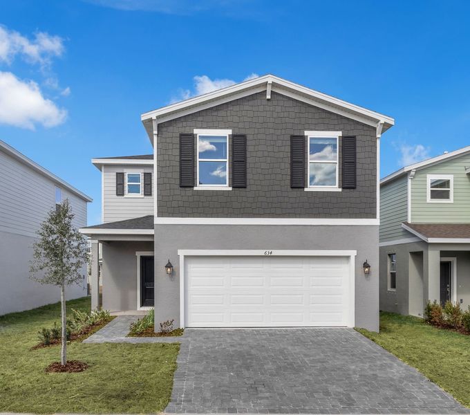 Front exterior of a new home in Oakfield Trails, Parrish, FL, highlighting curb appeal (Image 19). Front exterior of a new home in Oakfield Trails, Parrish, FL, highlighting curb appeal (Image 19).