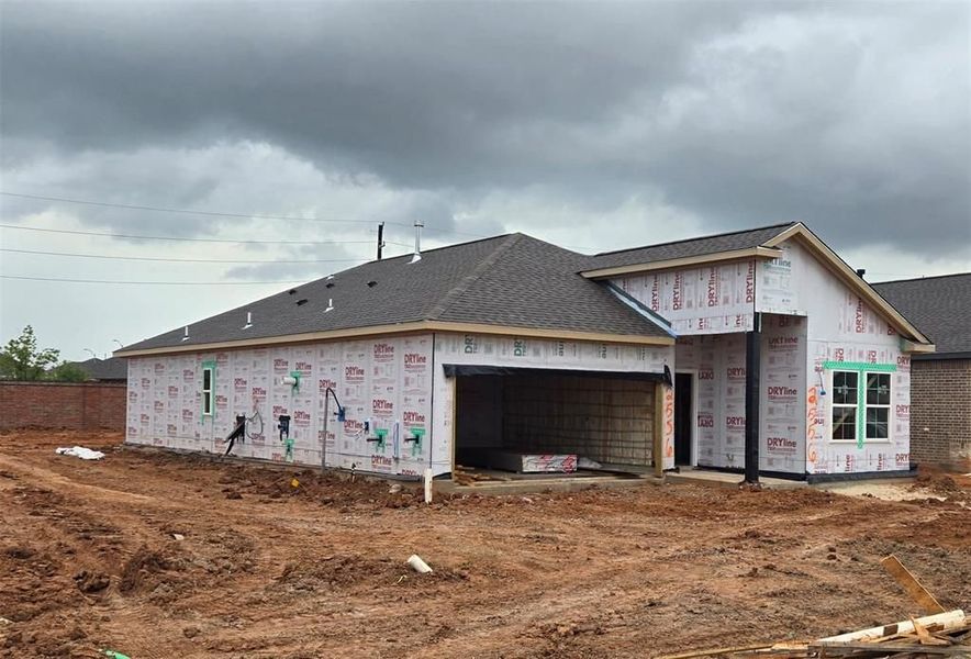 Front exterior of a new home in Sunterra, Katy, TX, highlighting curb appeal (Image 65). Front exterior of a new home in Sunterra, Katy, TX, highlighting curb appeal (Image 65).