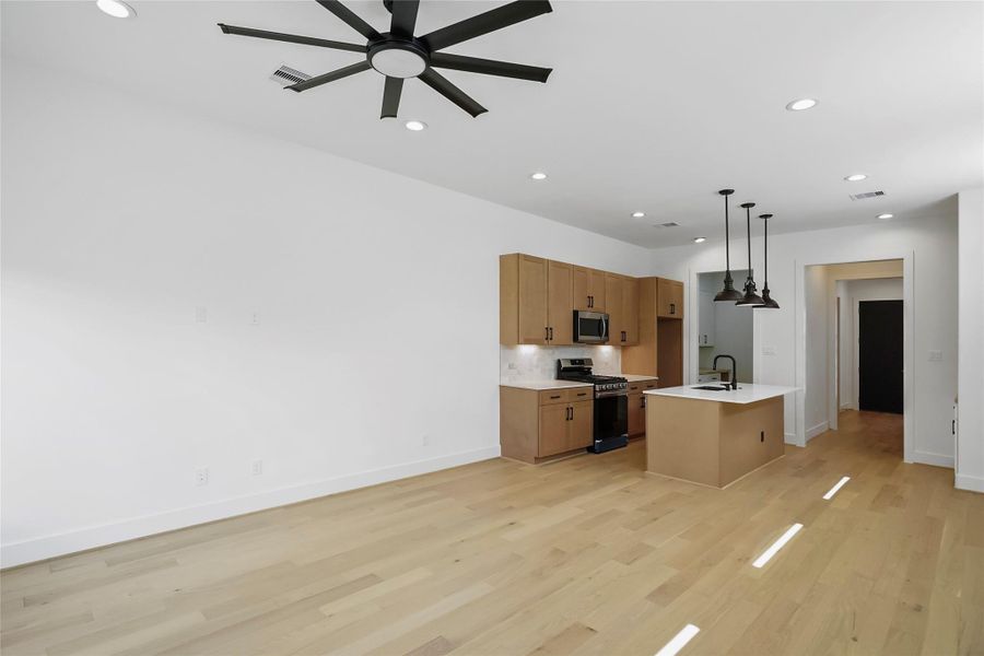 Discover modern elegance with sleek ceiling fans and premium white oak floors. Discover modern elegance with sleek ceiling fans and premium white oak floors.