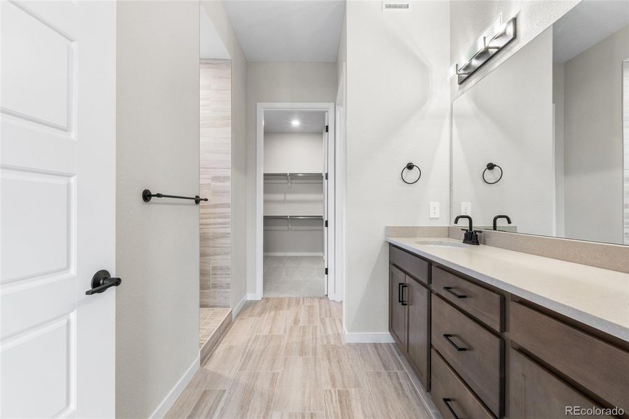 Furnished interior view inside a new home in Hilltop at Inspiration, Aurora (Image 13).