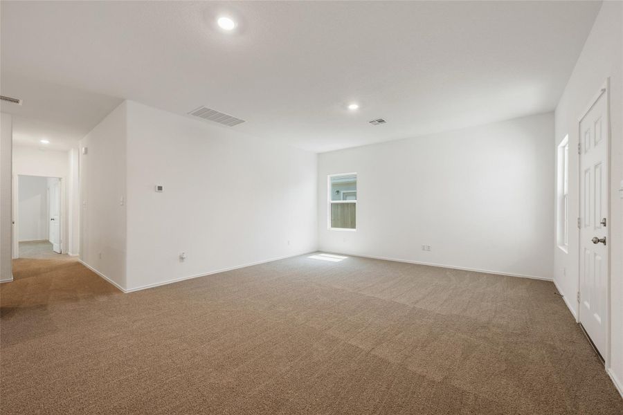 Spare room featuring carpet floors and recessed lighting Spare room featuring carpet floors and recessed lighting