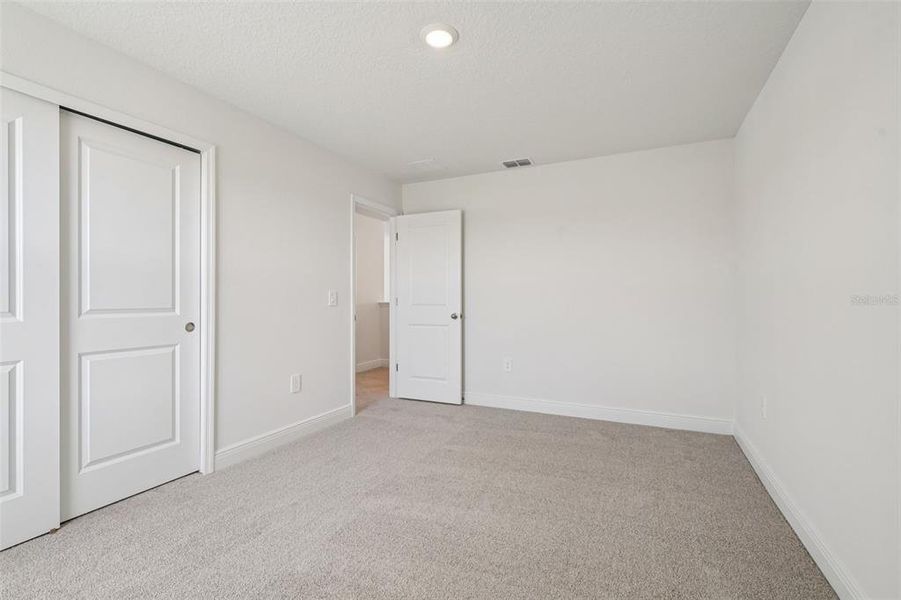 Spacious, unfurnished interior of a new home in The Reserve at Hammock Oaks - Signature Series, Lady Lake (Image 31).