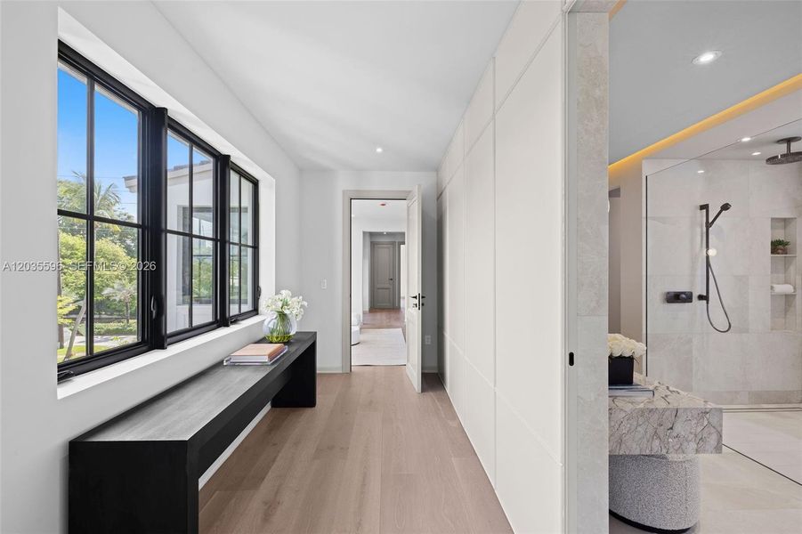 Walking from the media room into the primary bedroom Walking from the media room into the primary bedroom