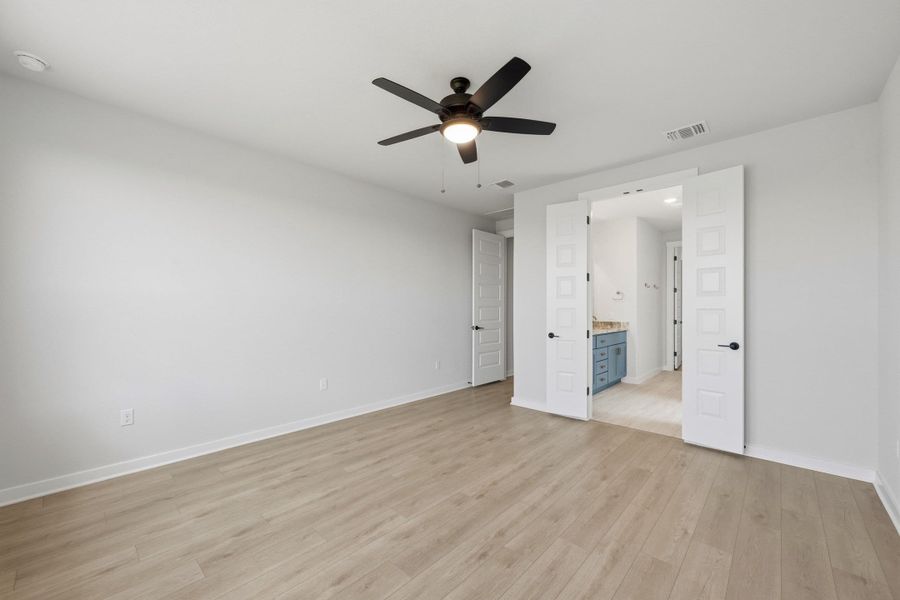 Spacious, unfurnished interior of a new home in Terrace Collection At Turner's Crossing, Buda (Image 35).